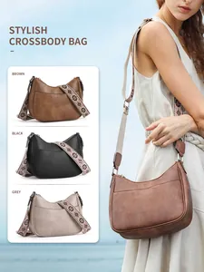 Checkerboard crescent bags in brown, black, and grey with woven floral straps