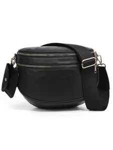 Detail of black checkerboard crossbody bag with gold zippers and mini coin purse