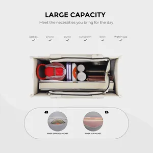 Overhead view showing large capacity of the beige tote bag with internal organizer pockets