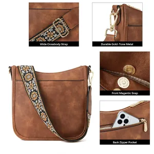 Detail view of brown vintage crossbody bag with floral woven strap and gold metal hardware