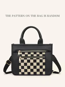 Close-up of black PU leather bag featuring a checkerboard pocket and gold dual zippers