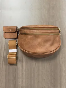 Detail view of brown PU leather crossbody bag set with small pouch and gold hardware