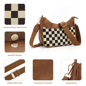 Brown faux leather crescent bag with checkered fabric panel and adjustable shoulder strap