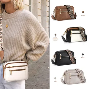 Retro PU leather crossbody bag with ethnic patterned strap and dual zipper pockets