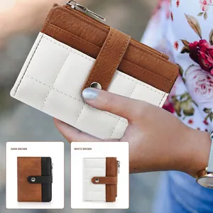 Quilted women's small wallet with button clasp and top zipper in white and dark brown