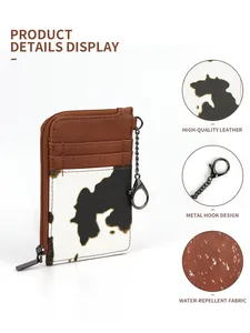 Macro detail of waterproof cow print wallet showing card slots and metal hook
