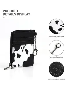 Detail showing cow print fabric, premium PU leather and metal carabiner on card holder