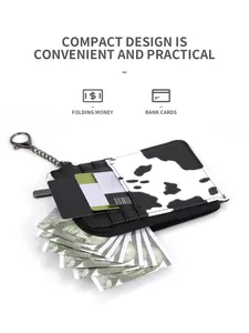 Compact cow print card holder with zipper pocket and metal chain on white background