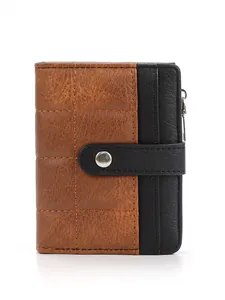 Detail view of checkerboard quilted texture on bifold wallet with snap and side zipper