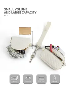 Detail view of a quilted cream wristlet set showing storage for cards, coins and lipstick