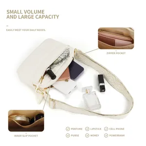 Cream quilted padded crossbody bag with wide strap and spacious inner pockets