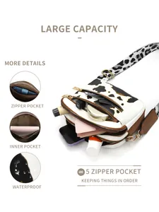 Detail view of cow print crossbody bag showing five zipper pockets and waterproof PU material