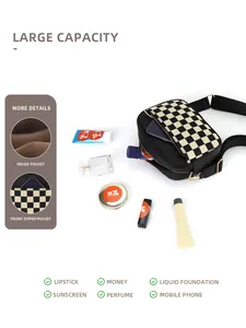 Detail view of checkerboard camera bag interior storage showing large capacity for essentials