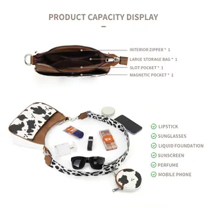 Brown leather crescent bag with cow print strap and round coin purse accessories