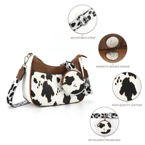 Cow print crescent shoulder bag with adjustable wide strap and detachable round coin purse