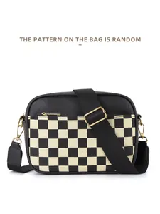 Detail of checkered crossbody bag with adjustable wide strap and gold hardware