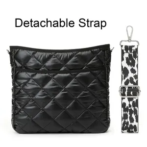 Detail of black quilted nylon crossbody bag featuring detachable leopard print strap