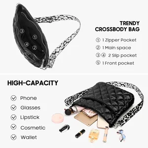 Quilted nylon crossbody bag with wide floral strap showing internal pockets and storage