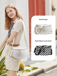 Detail of plaid crossbody bag with adjustable wide strap and matching mini coin pouch
