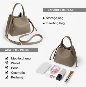 Capacity display of taupe bucket bag showing interior space for phone and makeup