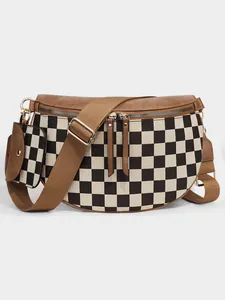 Detail of checkered crossbody bag with detachable earphone pouch and adjustable strap