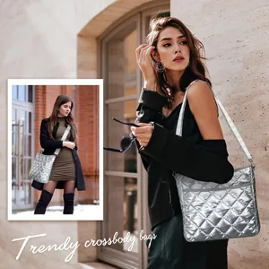 Close-up of metallic silver quilted crossbody bag with stylish rhombus patterns