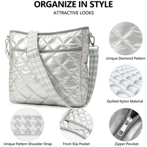Detail view of silver quilted nylon crossbody bag with houndstooth adjustable shoulder strap