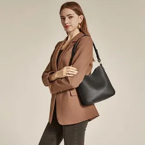 Minimalist black lychee leather bucket shoulder bag with elegant matte finish for women