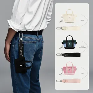 Portachiavi mini borsa in tela con chiusura a moschettone e cinturino in fettuccia