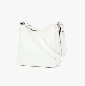 Minimalist cream white structured bucket bag with adjustable wide shoulder strap