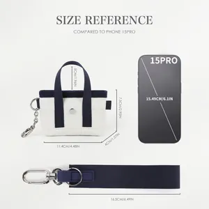 Mini borsa da polso in tela con cinturino blu e moschettone, vista con scala di misura