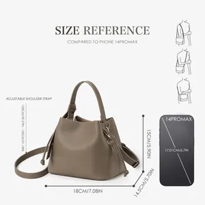 Taupe pebbled leather bucket bag with top handle and adjustable shoulder strap