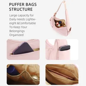 Pink quilted nylon puffer bag with large capacity storage structure and multi-pocket design