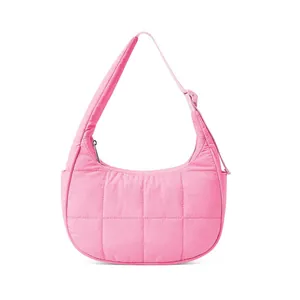 Detailed view of pink quilted nylon shoulder bag with adjustable strap and zipper