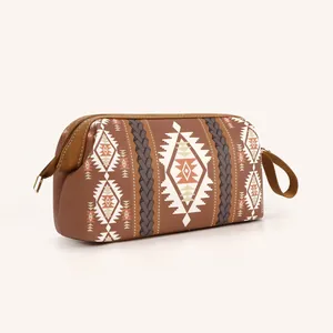 Detail of bohemian travel toiletry bag with ethnic patterns and durable brown handle