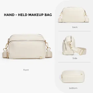 Vielseitige cremefarbene Nylon-Kosmetiktasche mit goldenen Zippern und Tragegurt