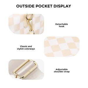 Detail showing the golden hardware clips, checkered fabric texture, and adjustable strap