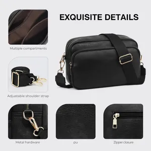 Detail view of black PU leather crossbody bag with multiple compartments and golden zippers