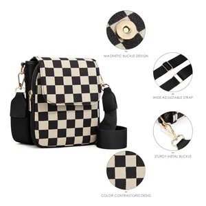 Detail view of checkerboard crossbody bag with magnetic buckle and adjustable strap