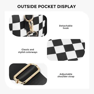 Detail of checkered tote bag featuring golden hardware hooks and adjustable black strap