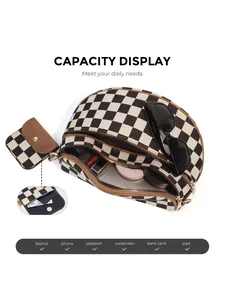 Capacity display of checkered crossbody bag showing interior space for tablet and makeup