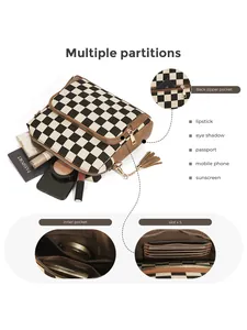 Detail of crossbody bag interior with multiple partitions, card slots and zipper pocket