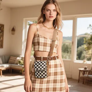Chic black and white checkerboard mini crossbody bag with adjustable wide shoulder strap