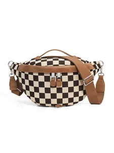 Detail of checkered canvas fanny pack with brown leather trim and metal zipper
