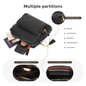 Black pebbled leather crossbody bag with multiple zip compartments and tassel detail