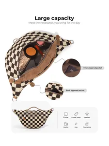 Detail view of large capacity checkerboard crossbody bag with multiple interior pockets
