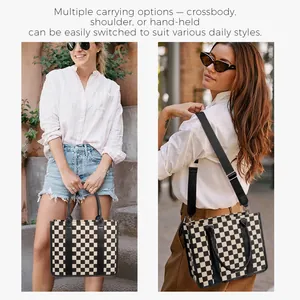 Detail view of checkerboard tote bag showing adjustable wide shoulder strap and top handles