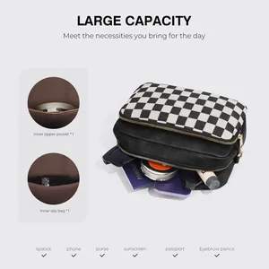 Crossbody bag interior detail showing multiple pockets and checkerboard pattern design
