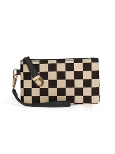 Detail view of checkerboard pattern canvas fabric with golden hardware and black wrist strap