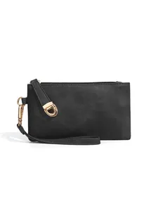 Detail showing the lychee texture of the black faux leather bag and gold metal D-ring buckle